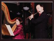 Woman playing harp and man playing flute at Shared Visions capital campaign celebration